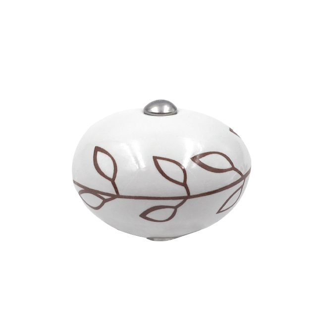 Poignée forme macaron cocotte céramique fleuilles rouge sur fond blanc